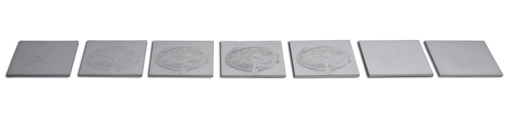 Contemporary art wall pieces of 7 squares of concrete with different reliefs and variance of the image of feminity.