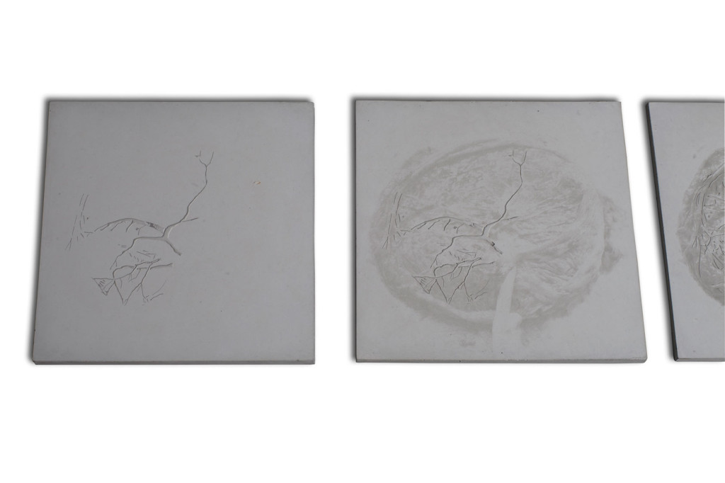 2 of 7 contemporary art wall pieces of square concrete with different reliefs and variance of the image of feminity as conveyed through the placenta.