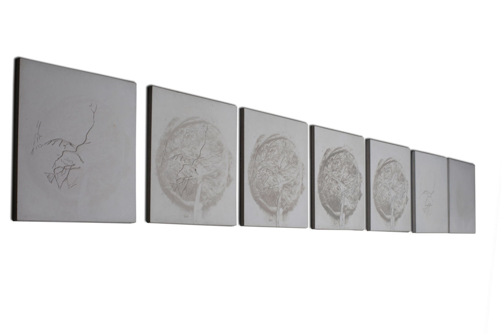 Set of 7 contemporary art wall pieces of square concrete with different reliefs and variance of the image of feminity.