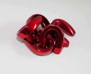 Cherry red boxing mouth guards as feminist art sculpture