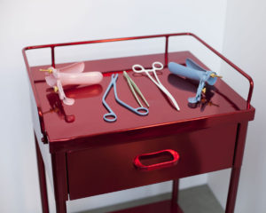 Medical cart sculpture as feminist art by Zoe Buckman