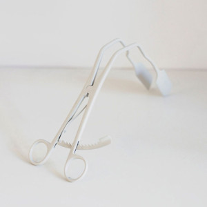 White powder coated gynecological speculum sculpture by contemporary feminist artist Zoe Buckman